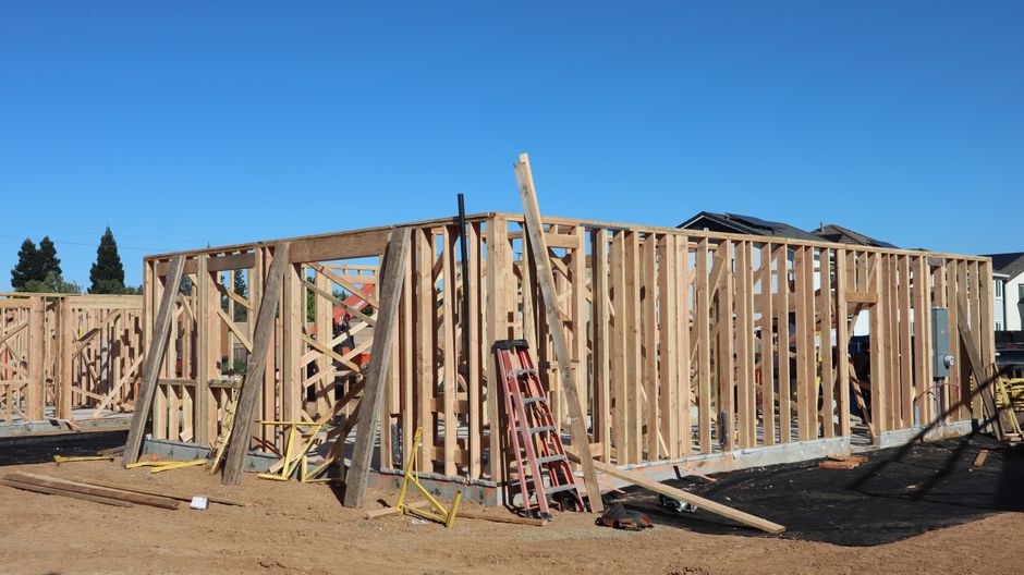 Timber frame of a new house under construction on a residential block