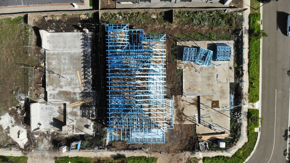 Concrete slab poured on a residential building site before framing starts