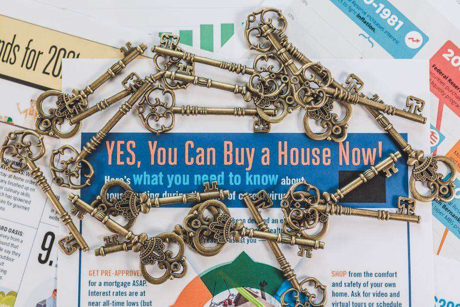 House keys resting on a mortgage document on a desk