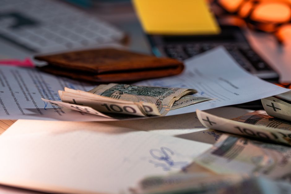 Superannuation paperwork and a calculator on a desk