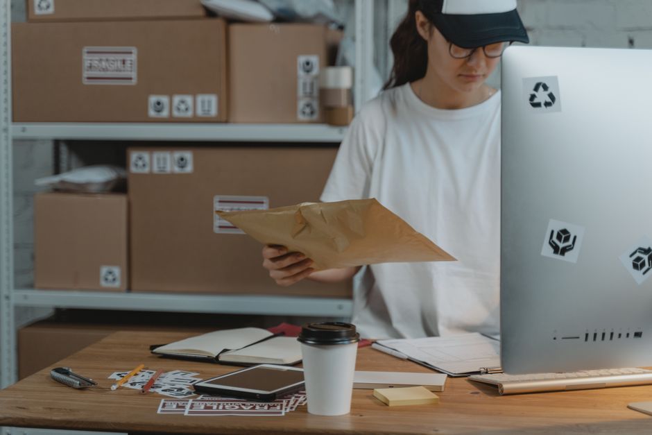 Business owner working in a warehouse office