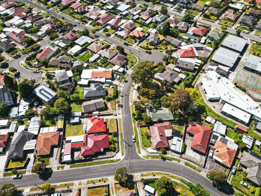 Aerial view of a Melbourne suburb with houses and tree-lined streets