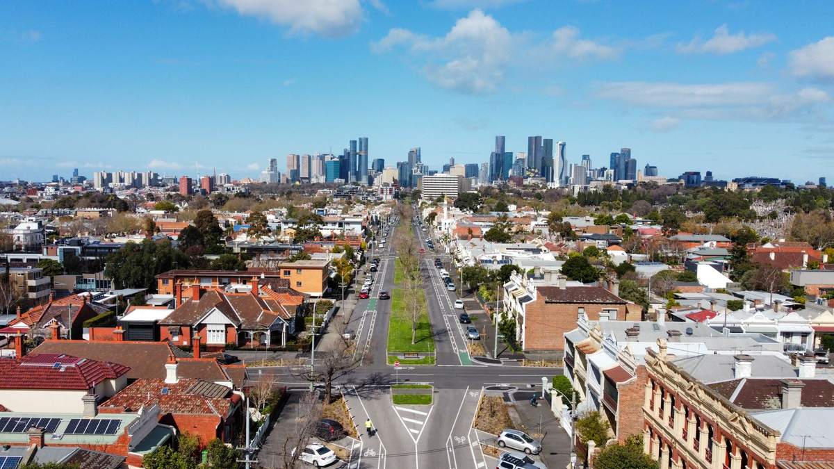 Aerial view of a Melbourne suburb with the city skyline in the distance