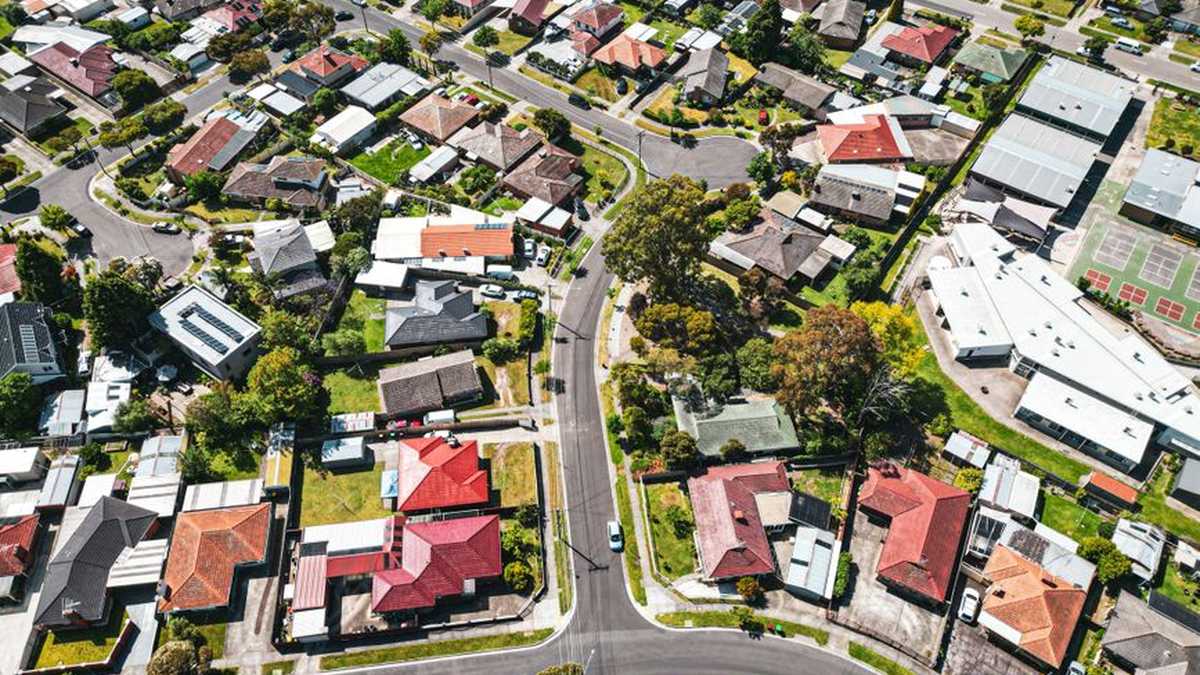Rooftops of an Australian suburb seen from above on a clear day